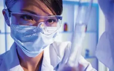Chinese Female Woman Scientist With Test Tube In Laboratory