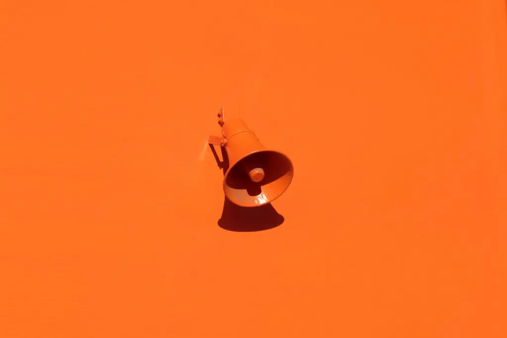 Megaphone on orange background