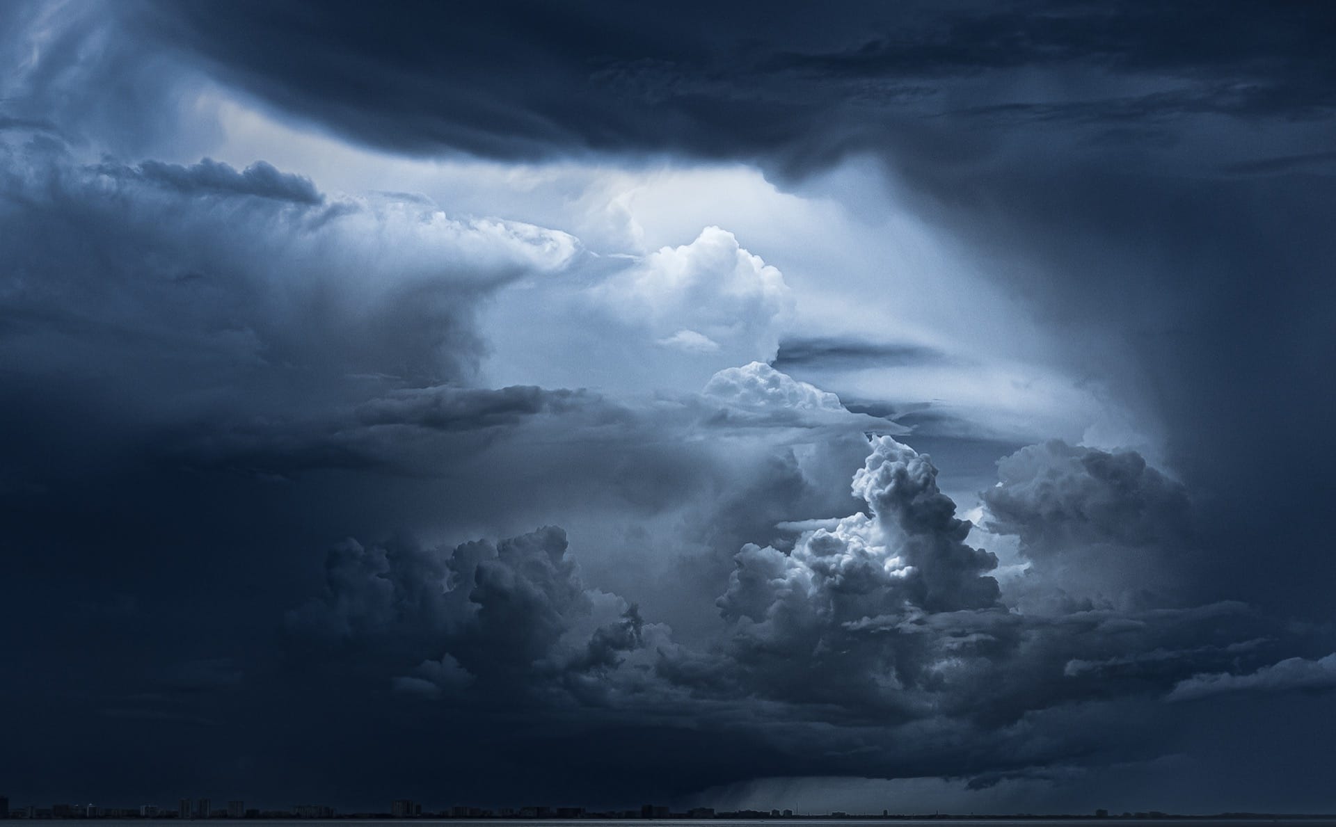 Storm clouds over a city skyline