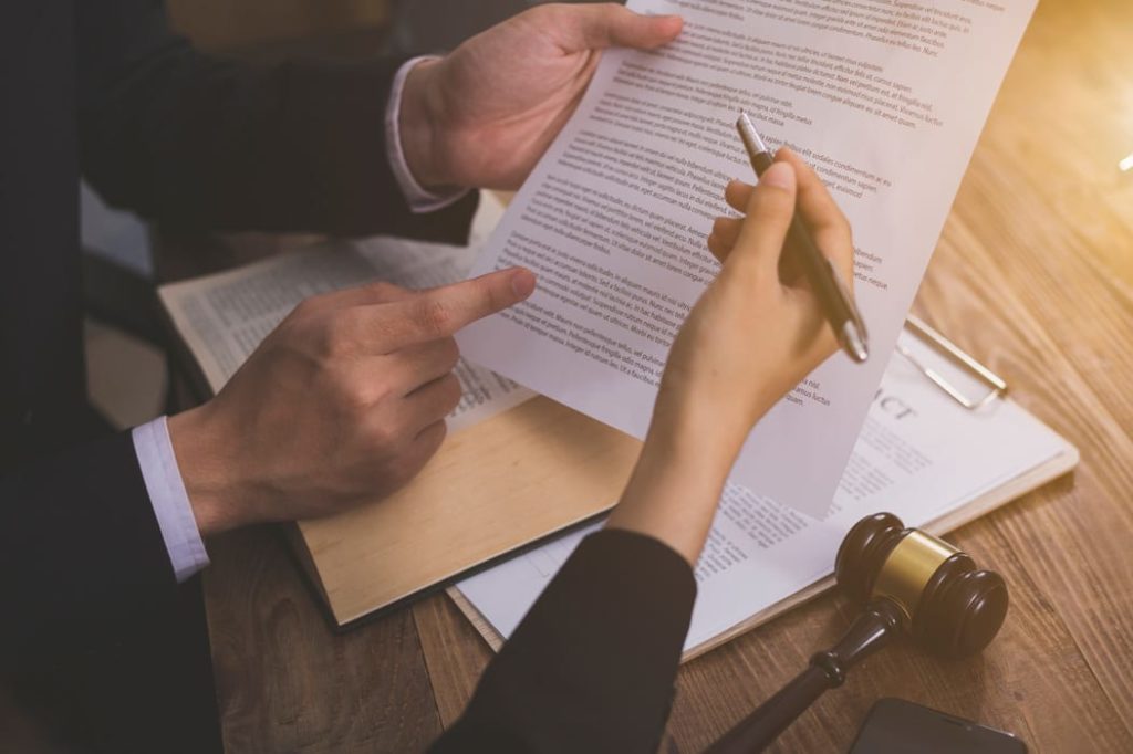 two people reviewing a legal document