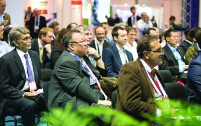 People in suits seated in an audience at the 2019 SSCT Meetings & Conference.