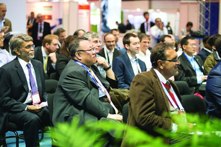 People in suits seated in an audience at the 2019 SSCT Meetings & Conference.