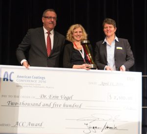 Dow Chemical’s Erin Vogel (center) accepts the prestigious American Coatings AWARD from ACA's Steve Sides and Vencentz Network's Sonja Schulte.