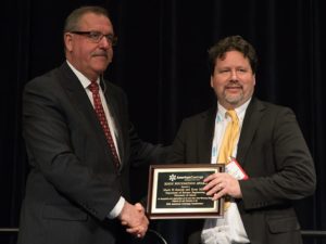 Mark Soucek, University of Akron, accepts the Second Place Roon Award from Steve Sides.