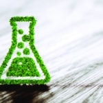 Green chemistry industry sign on black wooden background. 3D rendering.