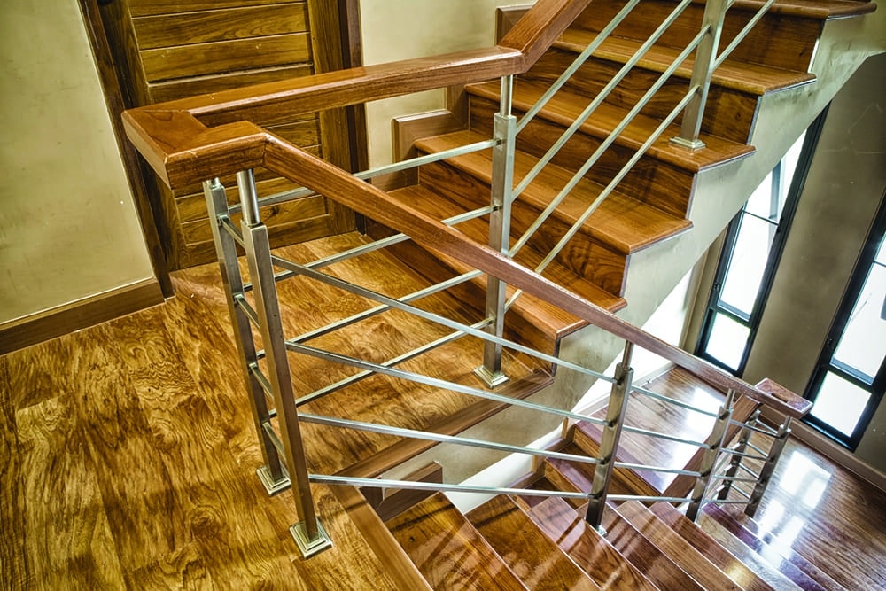 Indoor Concrete Staircase with wood handrail in the building