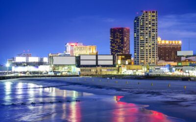 Atlantic City, New Jersey, USA resort casinos cityscape on the shore at night.