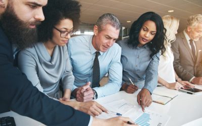 Contemporary multiracial team working on project in office