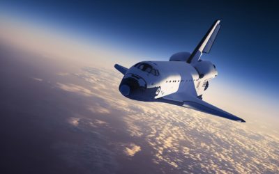 Space shuttle in flight over the earth
