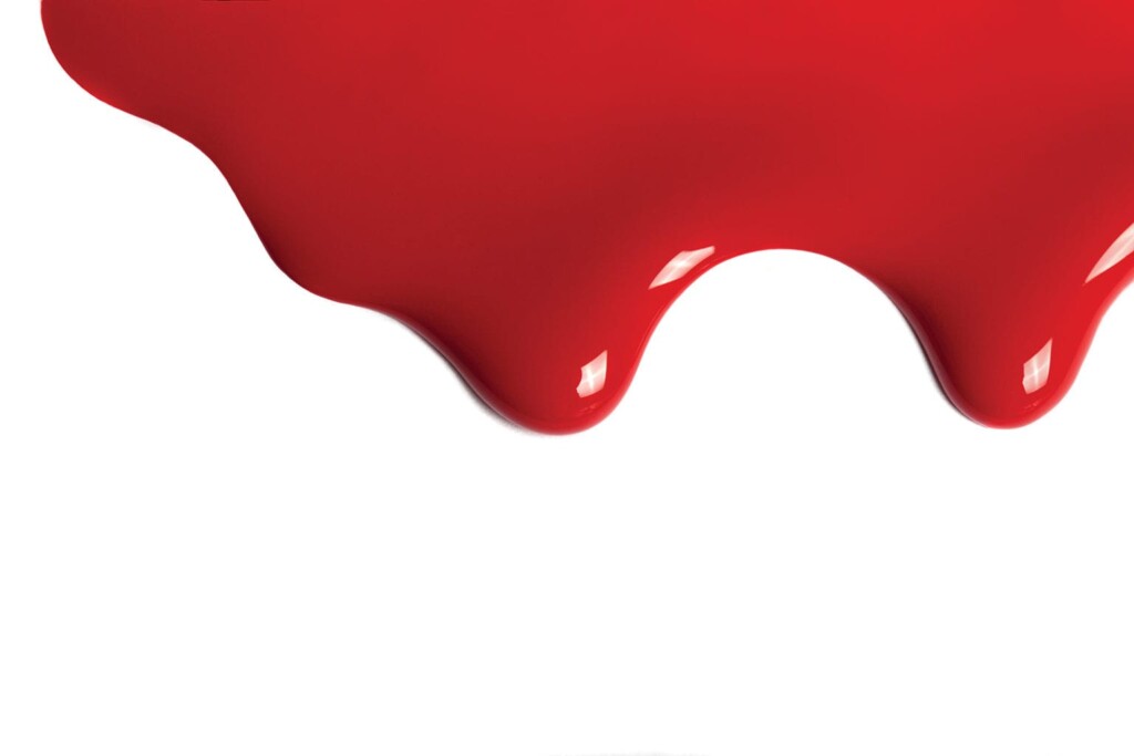 beautiful drip paint close up on white isolated background. drip red paint