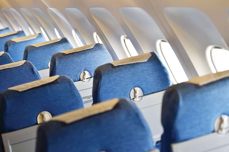 Blue airplane empty seats American Coatings Association