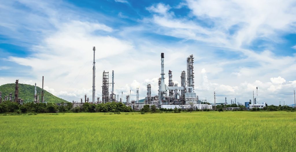 oil refinery plant against blue sky