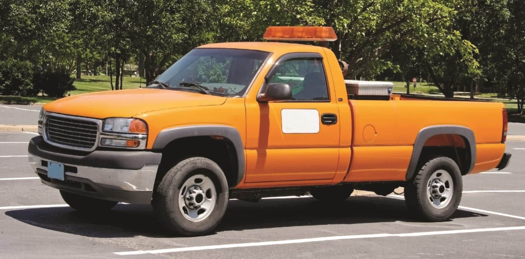 Orange department of transportation utility pickup truck.