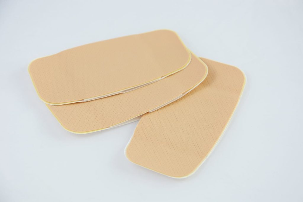 Large self adhesive bandages on white background