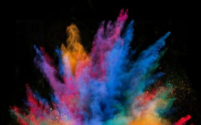 Explosion of colorful powder, isolated on black background