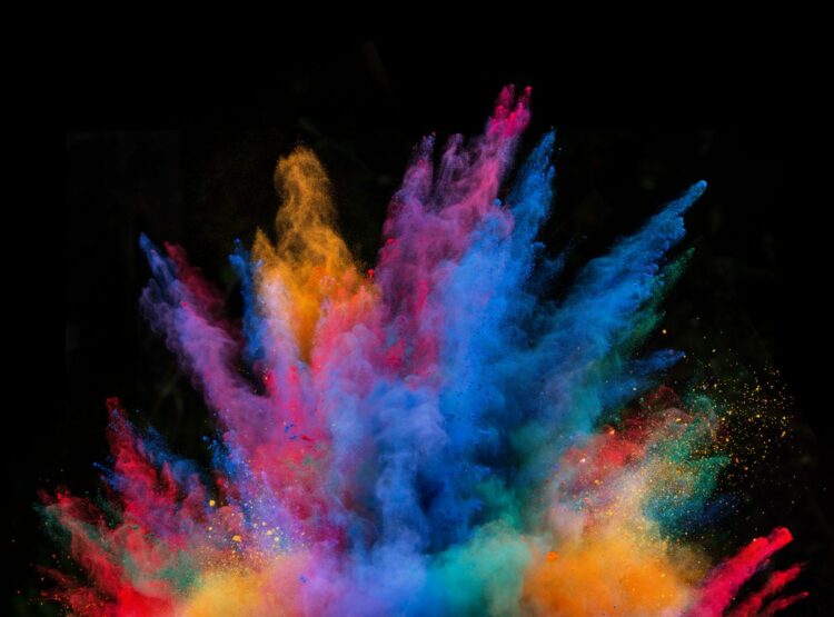 Explosion of colorful powder, isolated on black background