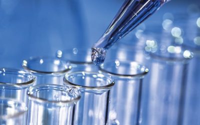 Pipette adding fluid to one of several test tubes