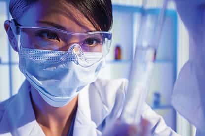 Chinese Female Woman Scientist With Test Tube In Laboratory