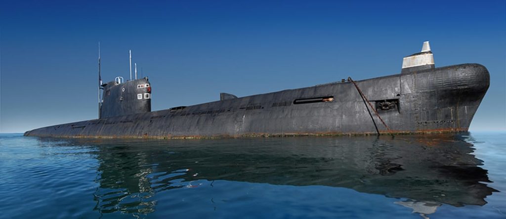 Russian submarine surfaced. Shot at water level against clear blue sky