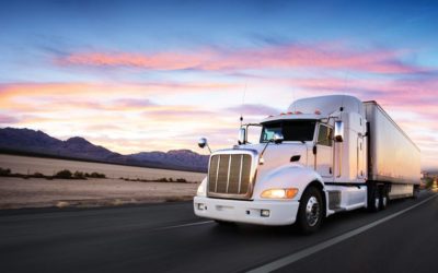 Truck and highway at sunset - transportation background