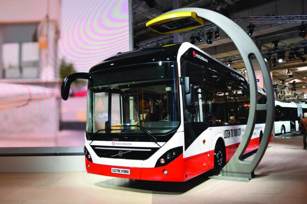 Hannover, Germany - September 24 th, 2014: The presentation of Volvo 7900 Electric Hybrid bus on the Hannover Motor Show (65th IAA Commercial Vehicles 2014). This bus is powered by 4-cylinder diesel engine (pushing out 240 HP) and electric engine (pushing out 150 kW). The charging time on the bus terminus (by pantograph) is up to 6 min. This charging system, with pantographs on the bus terminus, will be one of the most popular electric charging systems in European cities in future.