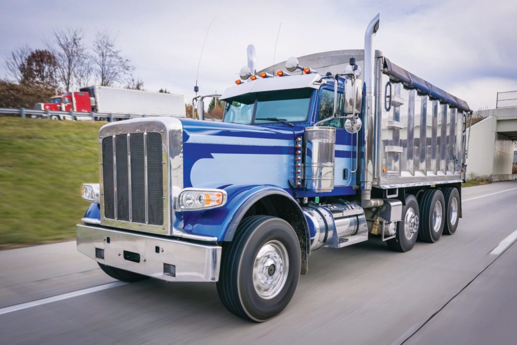 Dump truck on highway new truck chrome