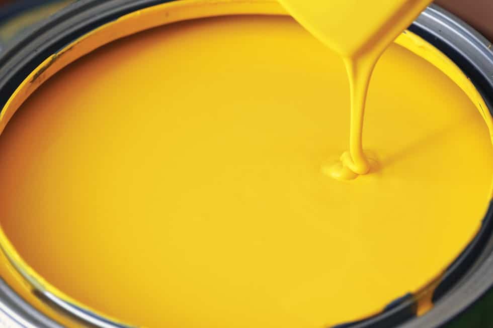 yellow paint in a paint can