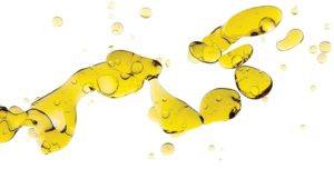Olive Oil. Abstract Blobs of Golden Oil Floating in Water