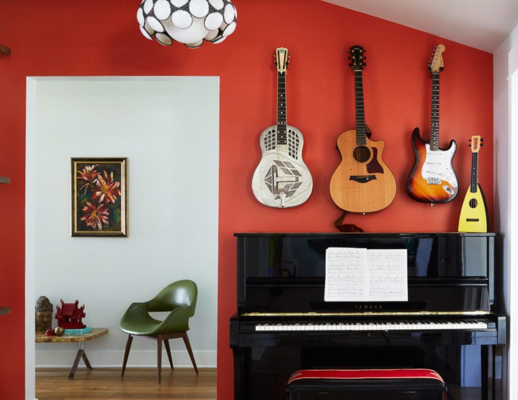 interior of a house with guitars hanging on the wall