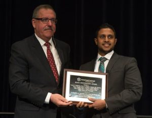 ACA's Steve Sides presents the First Place Roon Award to Teluka Galhenage, NDSU.