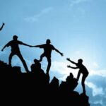Group of people on mountain peak