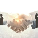 two professionals shake hands