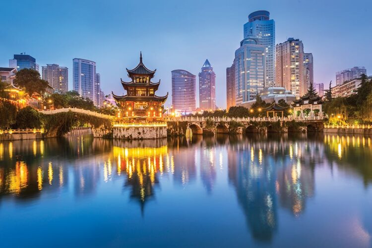 Cityscape of Guiyang at night, Jiaxiu Pavilion on the Nanming River. Located in Guiyang City, Guizhou Province, China.