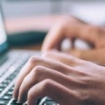 typing on a laptop keyboard