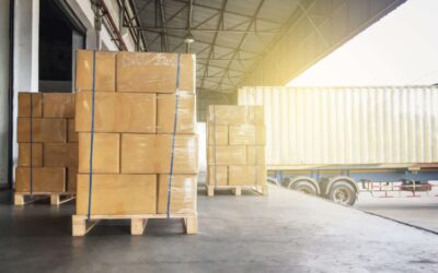 Warehouse cargo courier shipment. Stack of cardboard boxes on wooden pallet and truck docking at warehouse