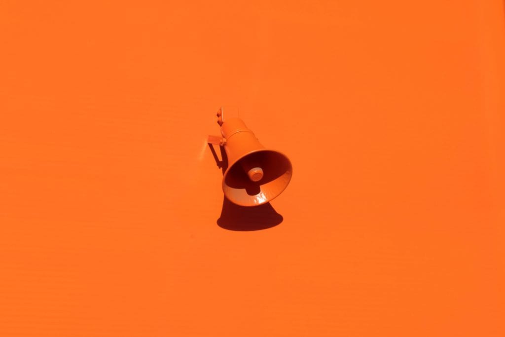 Megaphone on orange background