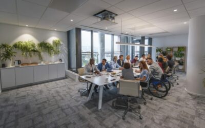 Executive Team Sitting at Conference Table in Board Room