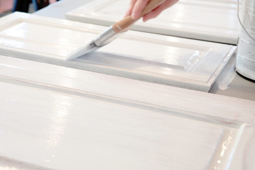 Man Painting Kitchen Cabinets