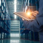 warehouse manager with tablet