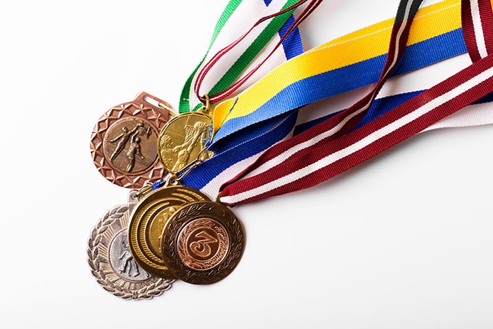 group of sport medals on white background