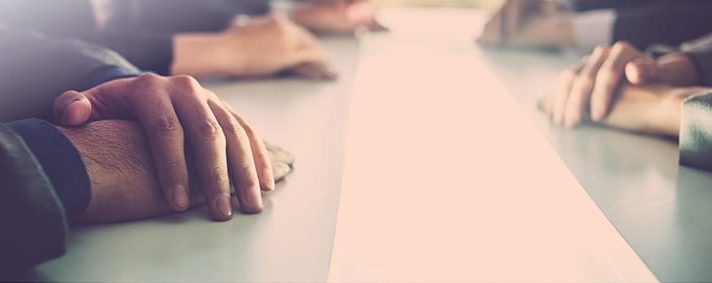 PICTURE OF HANDS ON TABLE