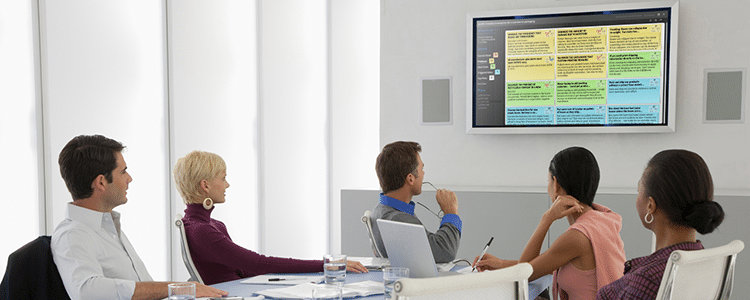 people sitting at a conference table