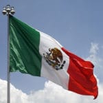 Flag of Mexico against blue sky