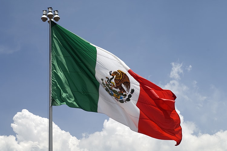 Flag of Mexico against blue sky