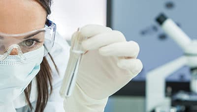 Woman Research Scientist With Test Tube In Laboratory Pan