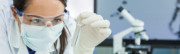 Woman Research Scientist With Test Tube In Laboratory Pan