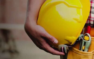 Construction worker with hardhat and tool belt