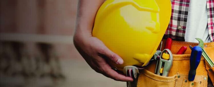 Construction worker with hardhat and tool belt