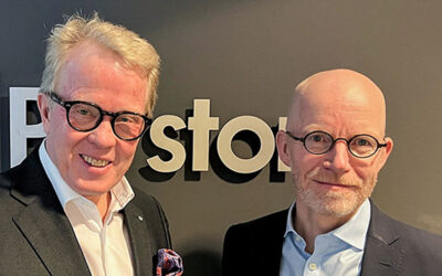 Jan Secher (left) and Ib Jensen (right) in front of a wall with the Perstorp Group logo.