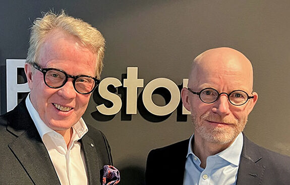 Jan Secher (left) and Ib Jensen (right) in front of a wall with the Perstorp Group logo.